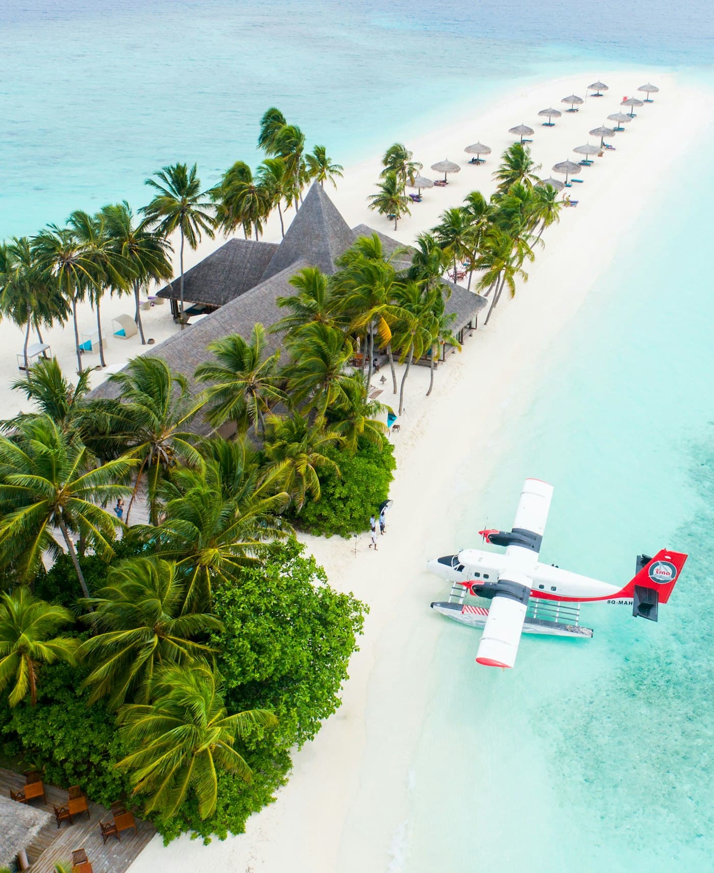 Aerial view of an island resort with seaplane