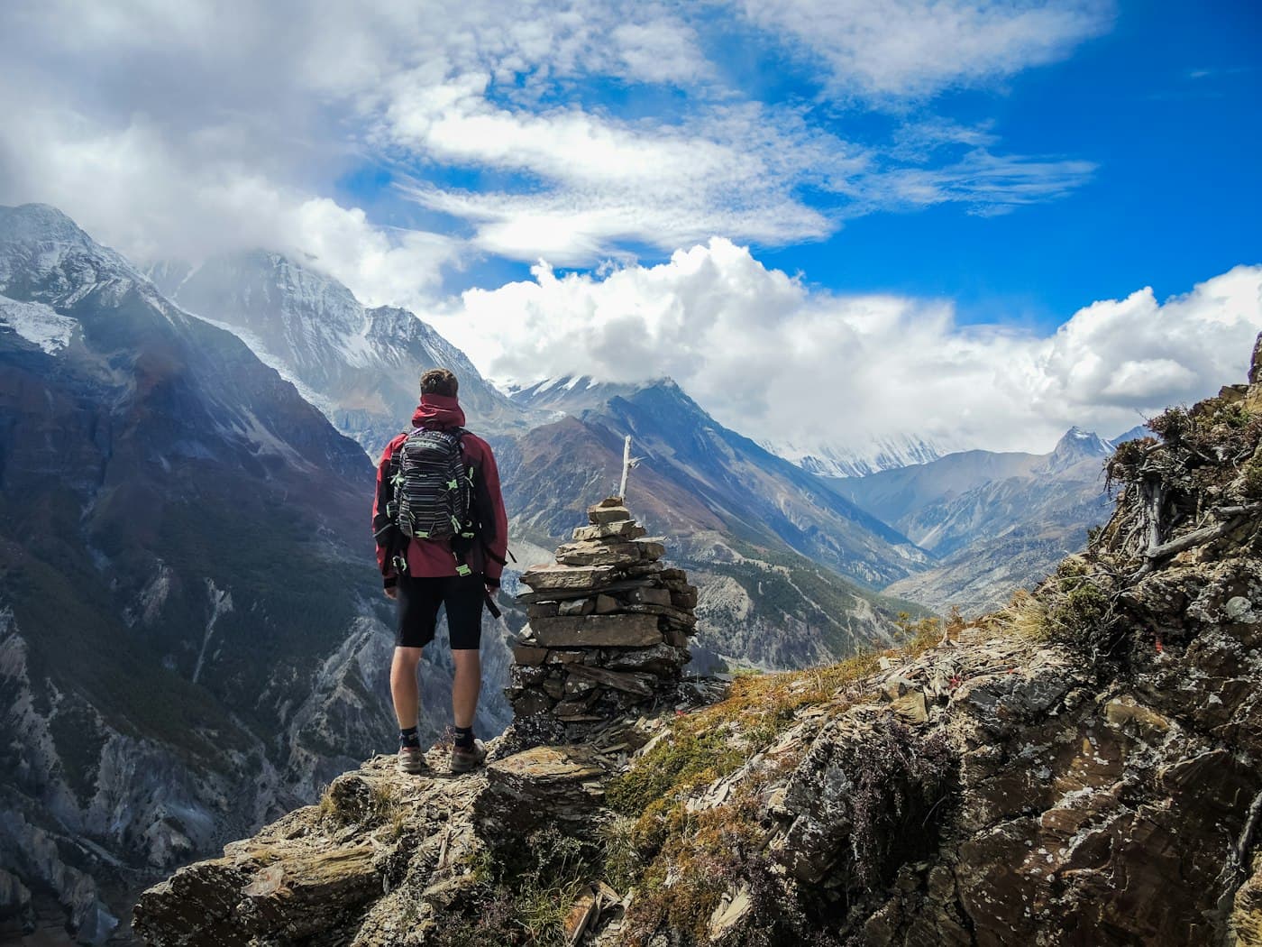 Hiker overlooking a Himalayan valley